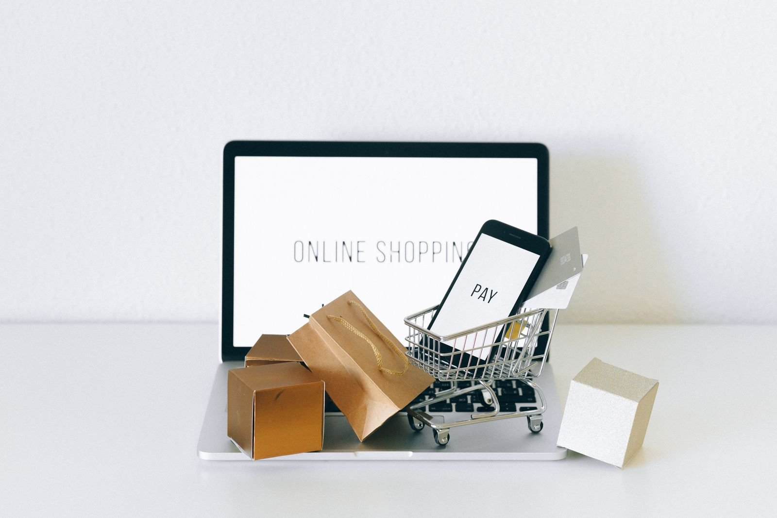 WooCommerce SEO guide online store laptop with miniature shopping cart