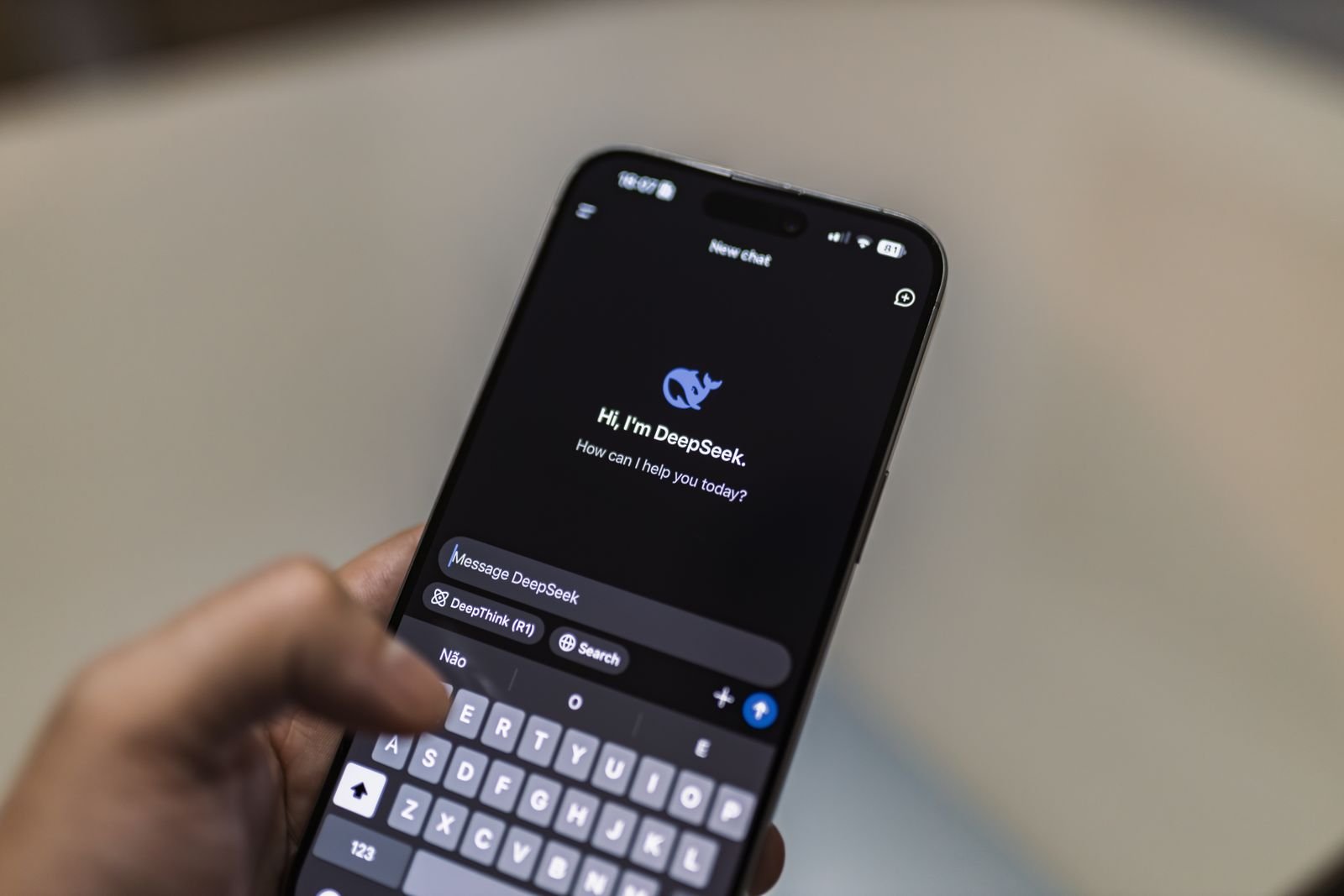Person using ChatGPT search on a smartphone for AI search optimization
