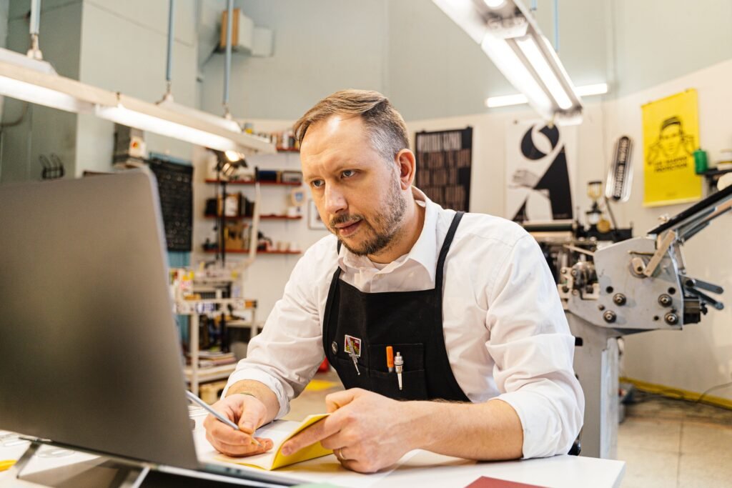 SEO services for small business guide showing an owner reviewing a monthly plan.