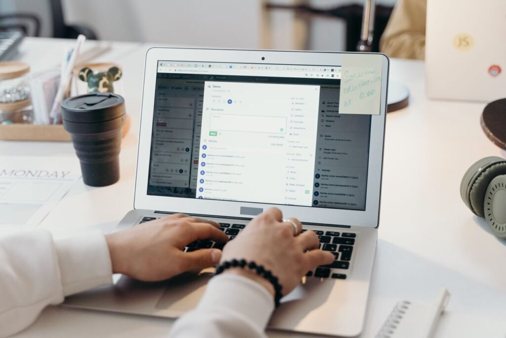 Link building beginner guide showing outreach work on a laptop